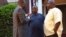 Rep Togba Mulbah (R) and George Mulbah (C) speak with VOA's James Butty (L)