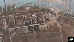 FILE - Satellite image provided by GeoEye shows the area around the Yongbyon nuclear facility in Yongbyon, North Korea. The U.S.-Korea Institute at Johns Hopkins School of Advanced International Studies said shows that North Korea has resumed building work on a reactor after months of inactivity at the site. 