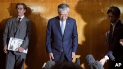 International Olympics Committee member and head of the Japanese Olympic Committee Tsunekazu Takeda bows as he speaks after a JOC executive board meeting in Tokyo Tuesday, March 19, 2019. Takeda is resigning amid a bribery scandal. (AP Photo/Eugene Hoshiko)