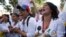 Nurses shout slogans during a protest against the government of President Nicolas Maduro, in Caracas, Venezuela, Aug. 16, 2018. The nurses were confronted by a phalanx of police officers that prevented them from marching toward Miraflores Presidential Palace several miles away.