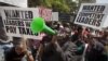 Kenyans demonstrate against their Members of Parliament who last week quietly awarded themselves a $110,000 bonus for five years of service in parliament, in downtown Nairobi, Kenya, October 9, 2012.