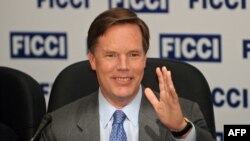 FILE - Nicholas Burns gestures during a meeting at the Federation of Indian Chambers of Commerce and Industry headquarters in New Delhi, Aug. 18, 2009. President Joe Biden on Aug. 20, 2021, nominated Burns to become ambassador to China.