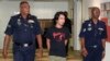 FILE - Activist Adam Adli is escorted by police at a courthouse in Kuala Lumpur.