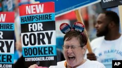 Cynthia Audesse, of Manchester, N.H., a supporter of Democratic presidential candidate Sen. Cory Booker, D-N.J, cheers during a rally outside the New Hampshire state Democratic Party convention,in Manchester, NH., Sept. 7, 2019. 