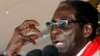 Zimbabwe's President Robert Mugabe gestures as he speaks during an event marking his 89th birthday in Bindura, about 90 km north of the capital Harare Mar. 2, 2013. 