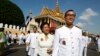 FILE PHOTO - Opposition leader of Cambodia National Rescue Party Sam Rainsy, foreground, walks together with his wife Tioulong Saumura after attending a celebration marking the 10th anniversary of Cambodian King Norodom Sihamoni's coronation, in front of the Royal Palace, in Phnom Penh, Cambodia, Wednesday, Oct. 29, 2014. In a rare public speech, Cambodia’s King Norodom Sihamoni urged his compatriots to be united for the sake of the nation. (AP Photo/Heng Sinith)