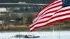 A diving team and police boat work near a wreckage site in the Potomac River near Ronald Reagan Washington National Airport in Arlington, Virginia, Jan. 30, 2025.