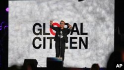 U2 lead singer Bono speaks at the Global Citizen Festival in Central Park in New York on Saturday, Sept. 26, 2015. The annual event is aimed at ending poverty around the world. 