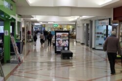 FILE - Shoppers are seen at a mall in Wellington, New Zealand, July 16, 2020.