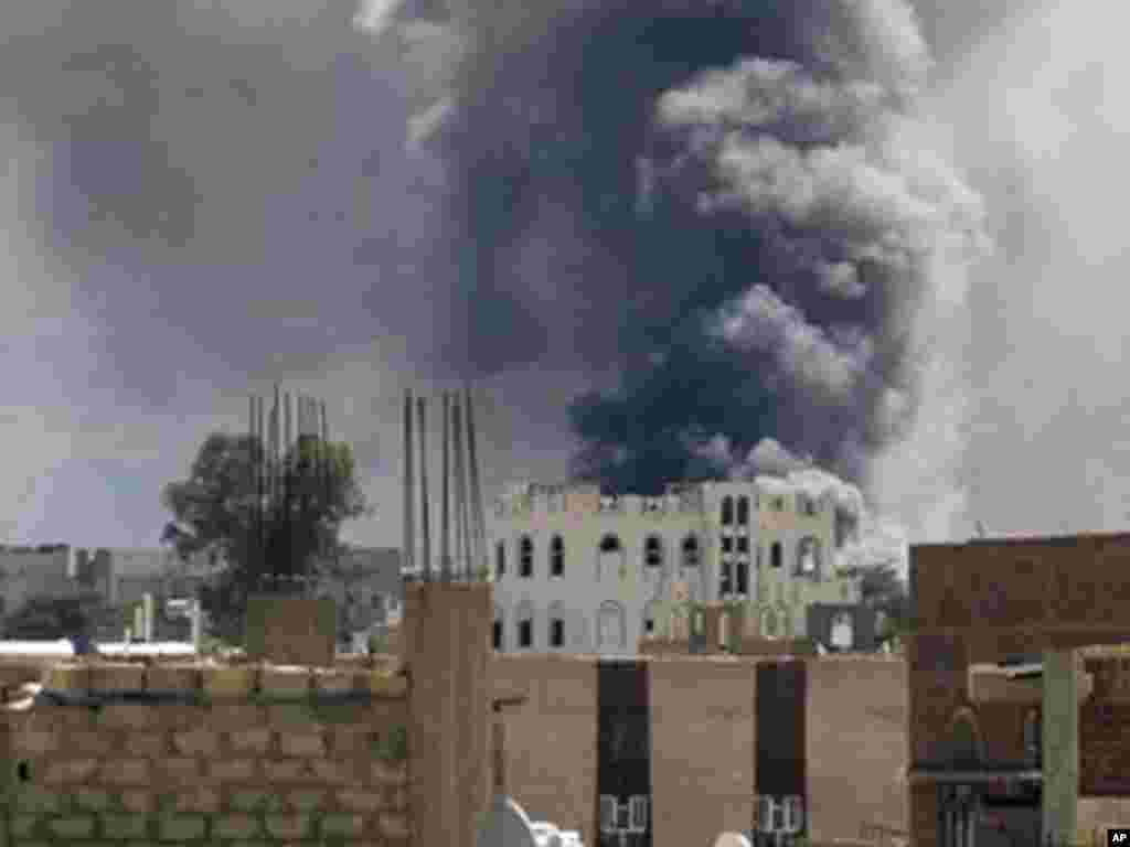 Smoke rises from a building during clashes in Sanaa in October. (AP)