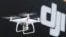 FILE - A Phantom 4, developed by major Chinese consumer-drone maker DJI, flies during its demonstration flight in Tokyo, March 3, 2016. 