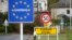 FILE -- A street sign marks the beginning of Schengen, Luxembourg. Schengen Agreement with the goal to illiminate internal border controls was signed there June 14, 1985. The European Union says it won't extend the temporary border controls beyond November. 