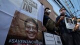 Activists hold photos of Thai dissident Wanchalearm Satsaksit gather for a rally in front of Cambodian Embassy in Bangkok, Thailand, Monday, June 8, 2020. Wanchalearm, has been abducted in Phnom Penh, Cambodia, a human rights group said Friday, raising co