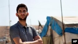 File- Sept. 1, 2019 photo, Syrian Abdel Hamid al-Yousef at a displaced settlement near the Turkish border. He lost his baby twins, his wife and 16 other relatives in the poison gas attack that hit Syria’s Khan Sheikhoun in April 2017.