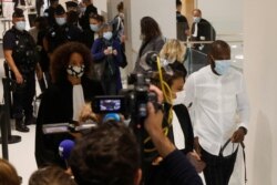Lassana Bathily, who saved hostages during the attack on the Hyper Cacher kosher supermarket, arrives for the opening of the trial of the 2015 Paris attacks, at a Paris courthouse, France, Sept. 2, 2020.