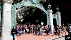FILE - Students walk on the University of California, Berkeley campus in Berkeley, California, on Aug. 15, 2017.