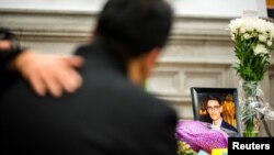 Ramin Jalalpour attends a vigil in memory of his cousin and Iranian student Amir Moradi, who was killed in the crash of a Ukrainian passenger plane near Tehran, at Queens University in Kingston, Ontario, Canada, Jan. 10, 2020.