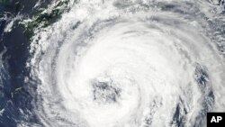 NASA's Aqua satellite captures this image of tropical Storm Talas over the western Pacific Ocean, September 1, 2011, as storm clouds reaches the southern shores of Japan.