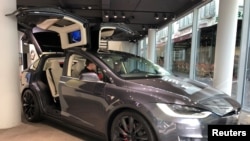 FILE - A Tesla Model X is on display at Telsa Inc's store in Frankfurt, Germany, Sept. 28, 2018.