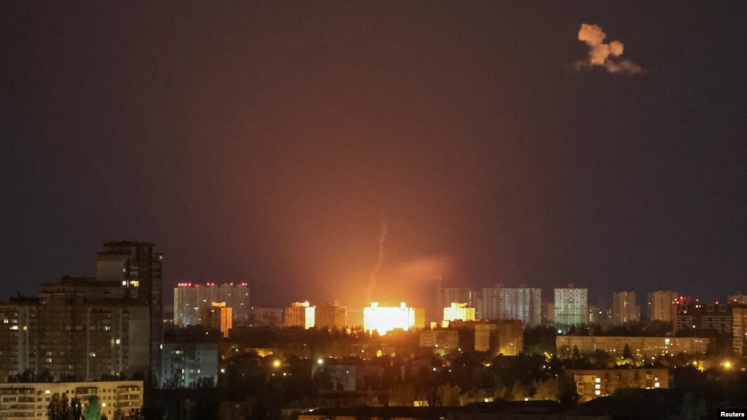 An explosion of a drone is seen during a Russian drone strike in Kyiv