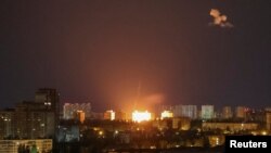 An explosion of a drone is seen during a Russian drone strike in Kyiv