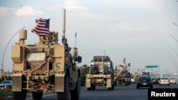 A convoy of U.S. vehicles is seen after withdrawing from northern Syria, in Erbil, Iraq, Oct. 21, 2019. 