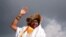 FILE - Kami Rita Sherpa, a Nepali mountaineer, waves toward the media in Kathmandu, Nepal, May 20, 2018.