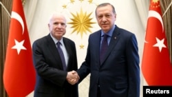 Turkish President Tayyip Erdogan, right, meets with U.S. Senator John McCain at the Presidential Palace in Ankara, Feb. 20, 2017.