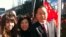 FILE - American businessman Vincent Wu, right, poses for a photo with his wife Yip Lai Fong, center, and daughter Anna Wu as they wait to welcome China's then-Vice President Xi Jinping on his visit to Los Angeles, Calif.