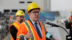 FILE - Andrew Wheeler, the U.S. Environmental Protection Agency's Acting Administrator, talks to reporters, Oct. 3, 2018, after touring the Georgetown Wet Weather Treatment Station in Seattle.