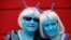 FILE - Science fiction enthusiasts Anne Clothier (L) and Gail Tomlinson, dressed as Andorians from Star Trek, pose for a photograph outside the 12th annual Sci-Fi London festival in east London, April 28, 2013. 