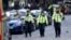  British police officers walk within a cordoned off area after an attack in the London Bridge area of London, June 4, 2017. Saturday night attackers killed several people in a series of vehicle and knife attacks before police shot them dead.