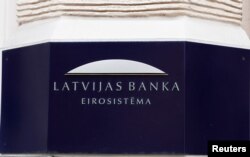 Latvian central bank sign is seen on the bank's headquarters in Riga, April 9, 2019.