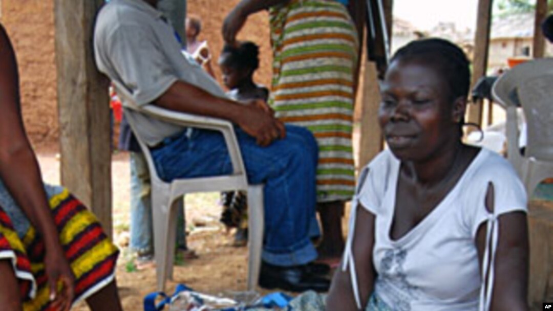 Refugee women in Tuzon, Liberia gather and sell produce to make money to feed their children