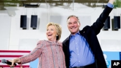 Democratic presidential candidate Hillary Clinton and Sen. Tim Kaine, D-Va., participate in a rally at Northern Virginia Community College in Annandale, Virginia, July 14, 2016.