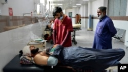 FILE - Injured men receive treatment at a hospital in Quetta, Pakistan, Oct. 11, 2024, following Thursday attack by gunmen in Balochistan province.