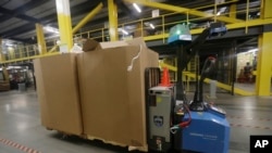 A robot carries boxes at the Amazon Fulfillment center in Robbinsville Township, New Jersey, Aug. 1, 2017.