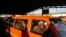 FILE - A taxi operator drives commuters in Pretoria, South Africa, June 1, 2020. Taxi drivers in the country's financial hub Gauteng went on strike to demand more goverment support during the coronavirus pandemic.