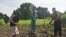 FILE - Farmers work in a field on the outskirts of Juba, Central Equatoria state, South Sudan, July 4, 2012.