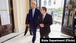 U.S. Secretary of State John Kerry and Cuban Foreign Minister Bruno Rodríguez enter the Cuban Ministry of Foreign Affairs before their bilateral meeting during the Secretary's historic visit to Havana on August 14, 2015. 