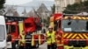 French firefighters and rescue forces stand near the entrance of the Russian consulate in Marseille after the consul general confirmed there had been an explosion, in Marseille, France, Feb. 24, 2025. 