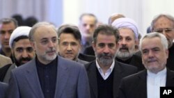 Ali Akbar Salehi, head of Iran's Atomic Energy Organisation (front, L), arrives for former Foreign Minister Manouchehr Mottaki's official farewell ceremony in Tehran, 18 Dec 2010