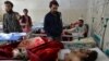 AFGHANISTAN -- Afghan victims receive medical treatment at a hospital following a suicide attack on a private construction company in Jalalabad, March 6, 2019