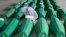 A girl inspects coffins prepared for burial, in Potocari near Srebrenica, Bosnia. The remains of 33 victims of Srebrenica massacre will be buried on July 11, 2019, 24 years after Serb troops overran the eastern Bosnian Muslim enclave of Srebrenica and executed some 8,000 Muslim men and boys.