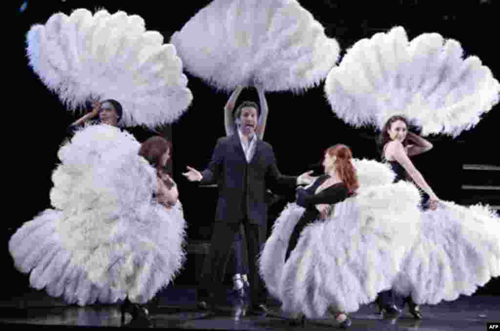 Peruvian actor Marco Zunino, in the role of Billy Flynn, performs a song with the cast of "Chicago" on the stage of Broadway's Ambassador Theater, in New York, Thursday, Jan. 12, 2012. (AP Photo/Richard Drew)