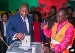 FILE - In this image taken from video, Central African Republic President Faustin-Archanche Touadera casts his vote at a polling station in Bangui on July 30, 2023.