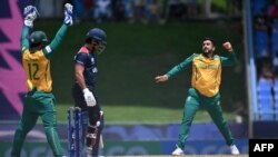 South Africa's Tabraiz Shamsi, right, celebrates an lbw against USA's Shayan Jahangir during the ICC men's Twenty20 World Cup 2024 Super Eight cricket match between the U.S. and South Africa at Sir Vivian Richards Stadium in North Sound, Antigua and Barbuda on June 19, 2024. 
