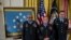 From left, Staff Sgt. Melvin Morris, Sgt. 1st Class Jose Rodela, and Spc. Santiago J. Erevia stand after being awarded the Medal of Honor by President Barack Obama, Tuesday, March 18, 2014.