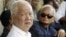 Former Khmer Rouge leaders Khieu Samphan, left, and Nuon Chea, right, look on during the funeral for Khieu Ponnary, the first wife of Khmer Rouge leader Pol Pot, file photo. 