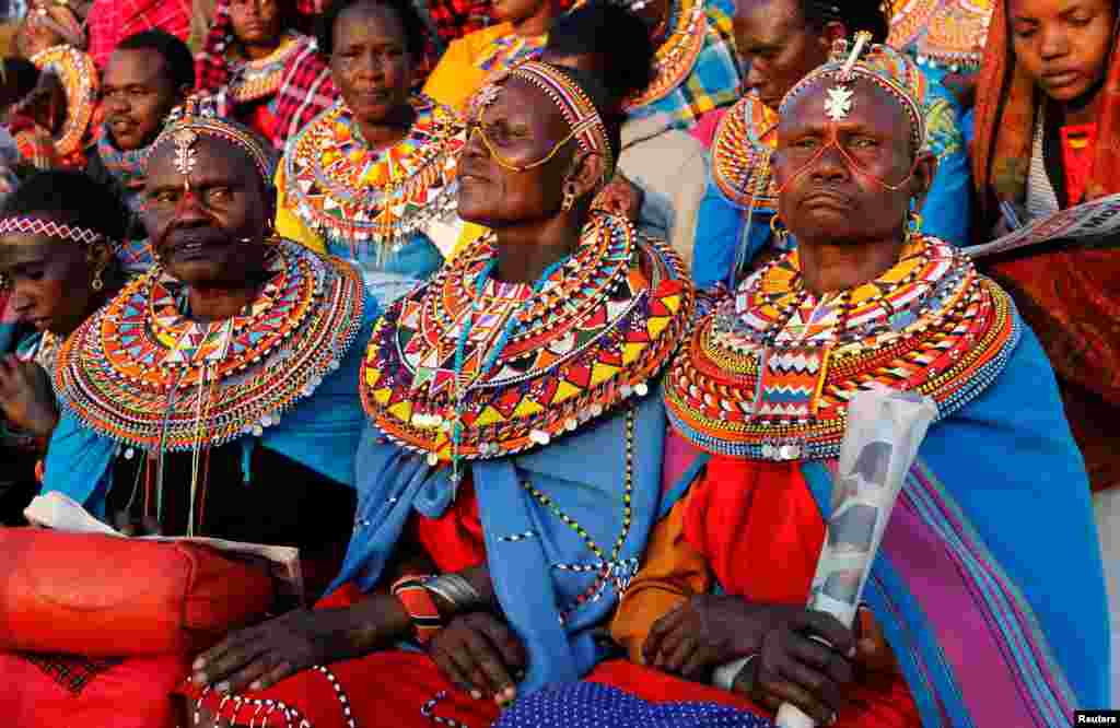 Maasai women dressed in traditional regalia attend a memorial service for the late Daniel Arap Moi, former Kenyan president, at the Nyayo Stadium in Nairobi.